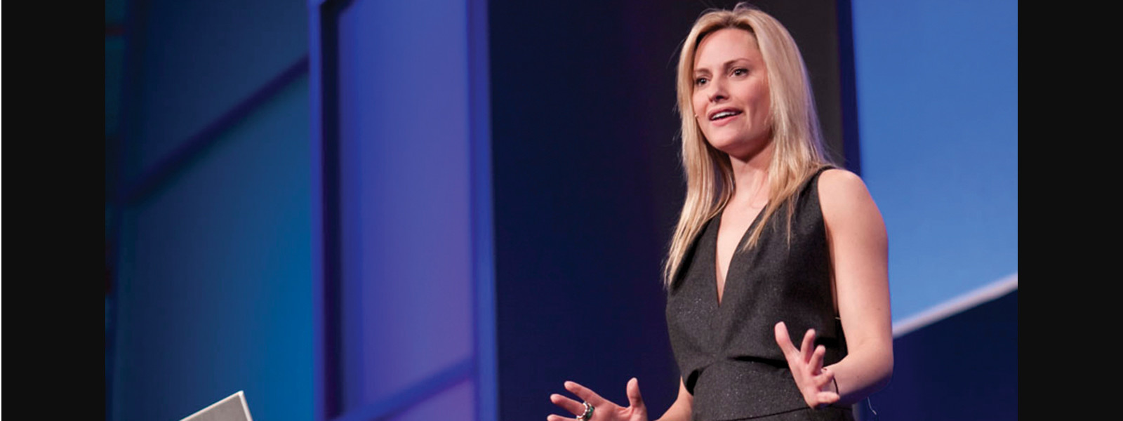 Photo showing Aimee Mullins speaking at a conference